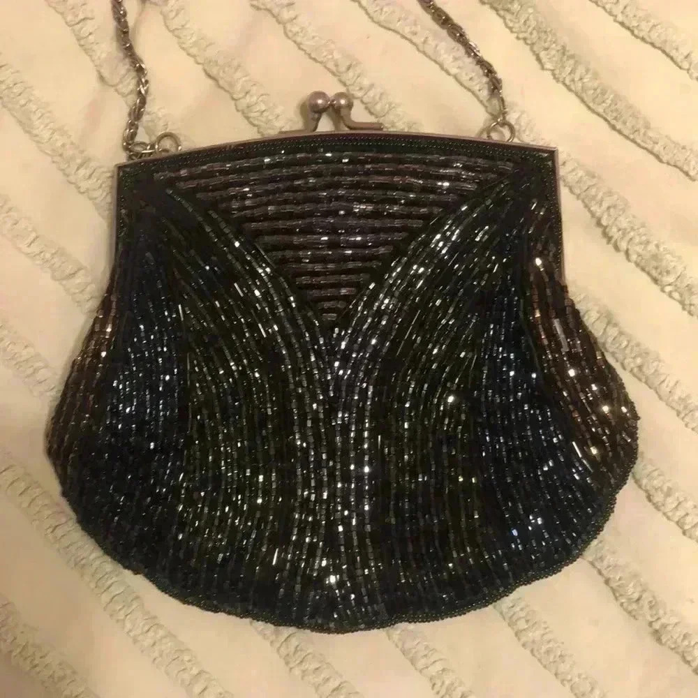 Vintage beaded bag with long chain strap.